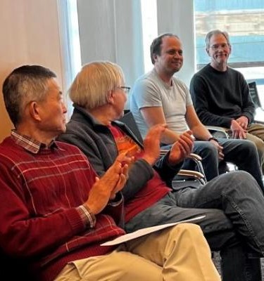 Brian Skinner surprised at faculty meeting with award